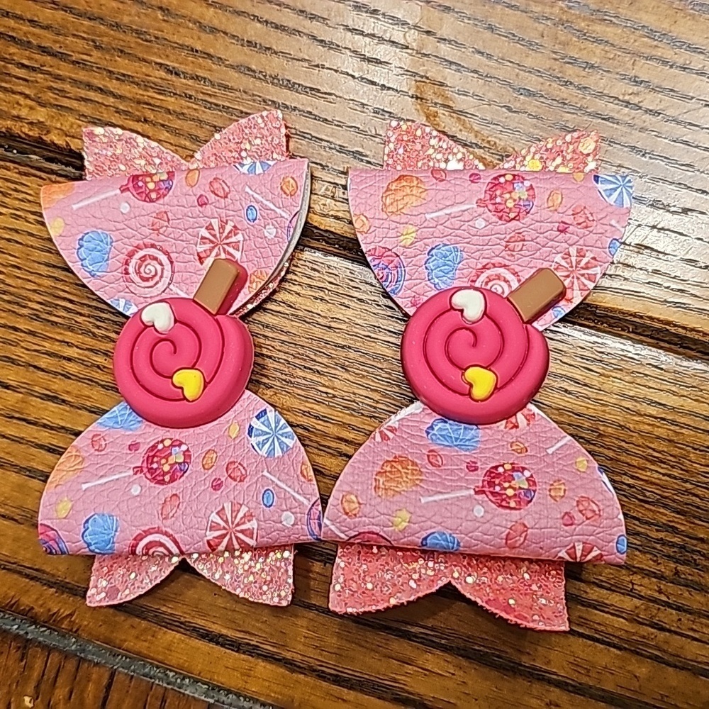 One pair of pink candy land hair bows